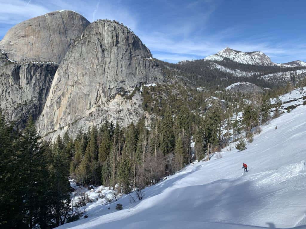 Skier with Liberty Cap, Half Dome and Cloud's Rest in the background
