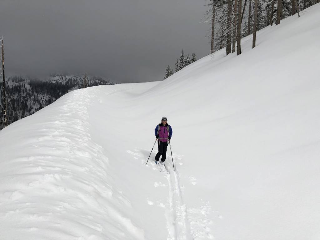 Skier on snowy road
